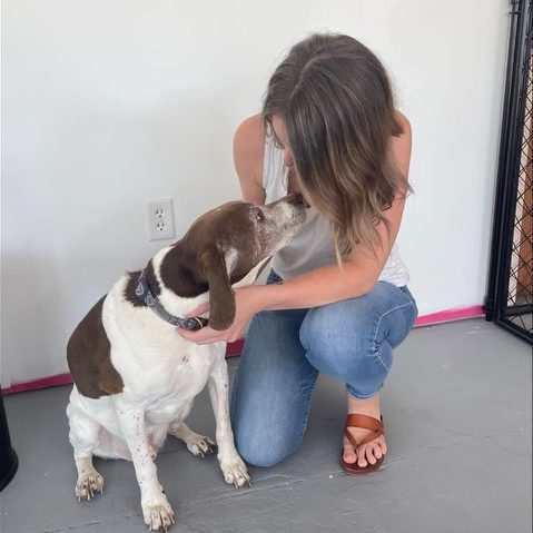 Manager showing off dog